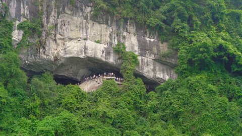 Entrance to the the biggest cave in the Halong Bay national park in Vietnam consisting of thousands of small and big limestone islands. Travel to Vietnam concept