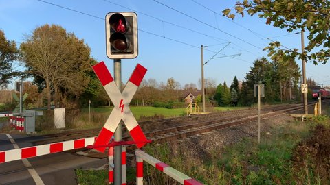 11/14/2020 hude germany: a regional train of the deutsche bahn drives past a level crossing