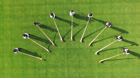 UNIQUE: Alphorns traditional instrument players filmed from above with a drone - Swiss national day symbol