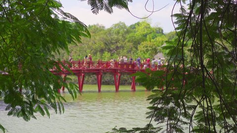 An iconic red wooden bridge to the Ngoc Son Temple in Hanoi city. Travel to Vietnam concept