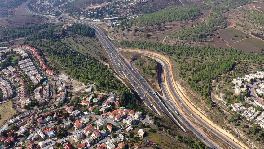 Highway in the mountains with red rooftops, Aerial view
Jerusalem tel aviv highway (road one) traffic, Israel,drone view
