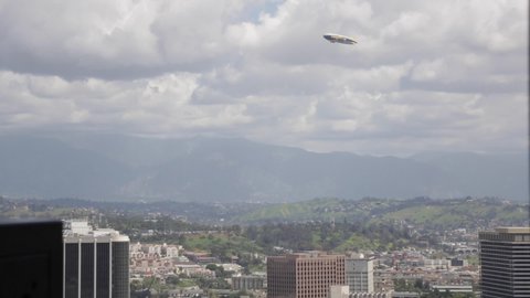Los Angeles , CA / United States - 01 27 2019: Los Angeles, California, Goodyear Blimp Flies High Over Downtown Los Angeles-02