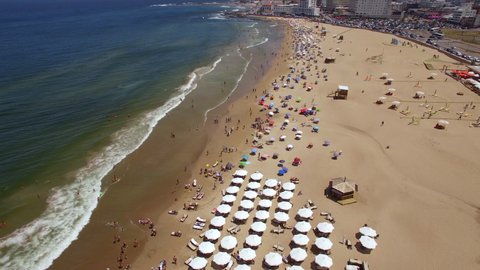 Aerial view of people enjoying the summer at famous Playa Brava beach in Punta del Este, Uruguay.