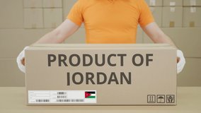 PRODUCT OF JORDAN printed text on the side of a big cardboard box in a warehouse - Powered by Shutterstock - Get 15% off with code: PIKWIZARD15