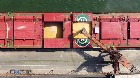 Freight ship landscape aerial view. Great industrial scene. Maritime transport. Global transport. Freight ship in the port. Freight ship in dock station. Dock station aerial view. Freighter transport.