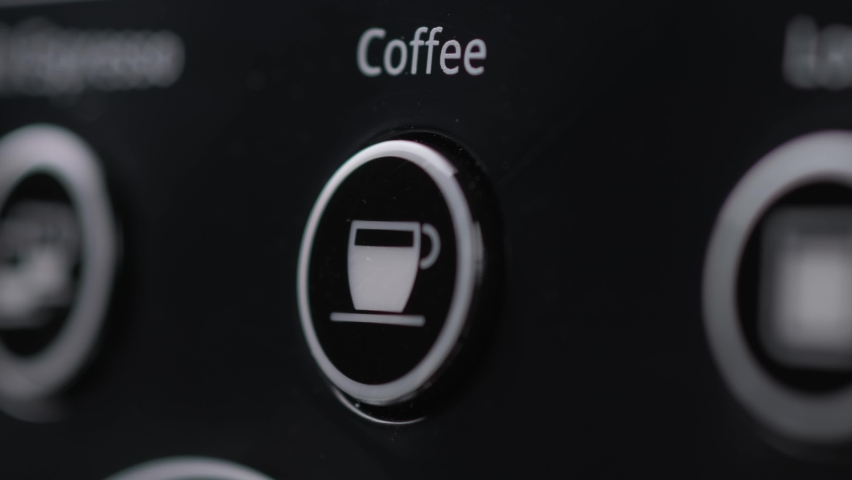 Close up Barista selects an Americano for making coffee presses button with word "Coffee" on coffee machine with her finger and prepares black fragrant hot coffee full of caffeine Royalty-Free Stock Footage #1062400435