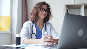 Latin female medical assistant video calling distant patient on laptop. Doctor talking to client using virtual chat computer app. Telemedicine, online webcam call professional conference chat. 