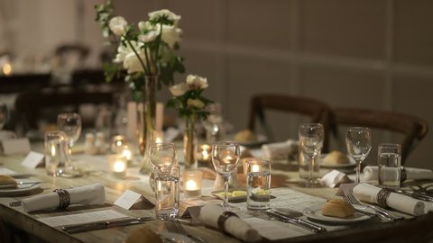 elegant dinner setting illuminated with candels