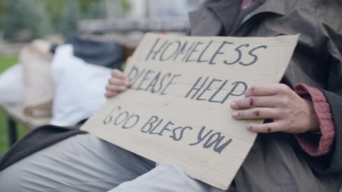 Homeless female holding please help sign in hands, migrant crisis, unemployment