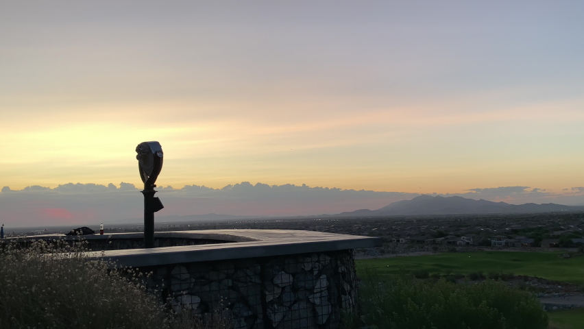 Woman at a Lookout Mountain enjoying the view at sunset