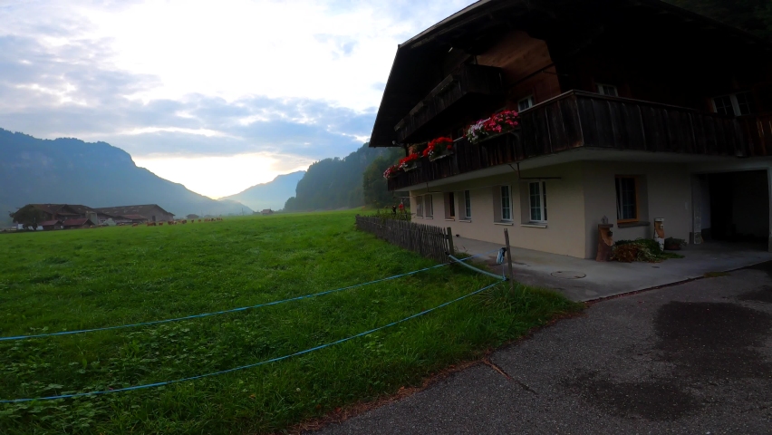 Traditional Swiss house in a village surrounded by Swiss Alps. Brienz, Switzerland.