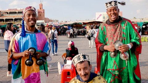 Morocco, Marrakech, March 2019, street performers entertain tourists who crowd the Jemaa el Fna square, the commercial center of the city