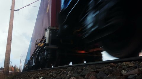 Cargo train on trail. Freight on tracks. Loopable seamless footage. Concept of transport, shipment, industry, container shipping and logistic.