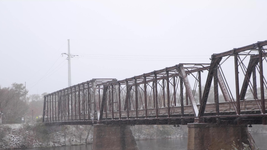 Old wooden and steel railroad bridge now a walking path in In Eau Claire Wisconsin