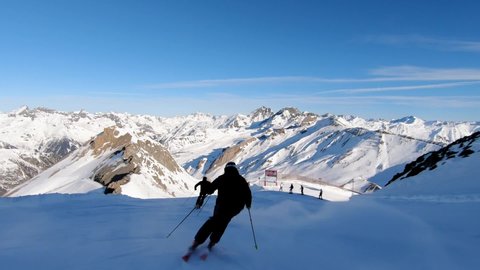 3 professional skiers show us a wunderful ski turn. Skiresort high up in tirolean mountains. Skiing with a awesome few.
