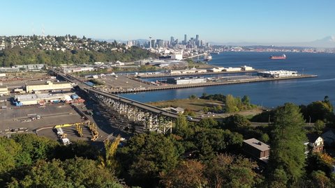 Aerial / drone footage of Smith Cove Cruise Terminal 91 in Interbay and Magnolia, Lawton Park, upscale, affluent Queen Anne neighborhoods uptown by Puget Sound, in Seattle, Washington