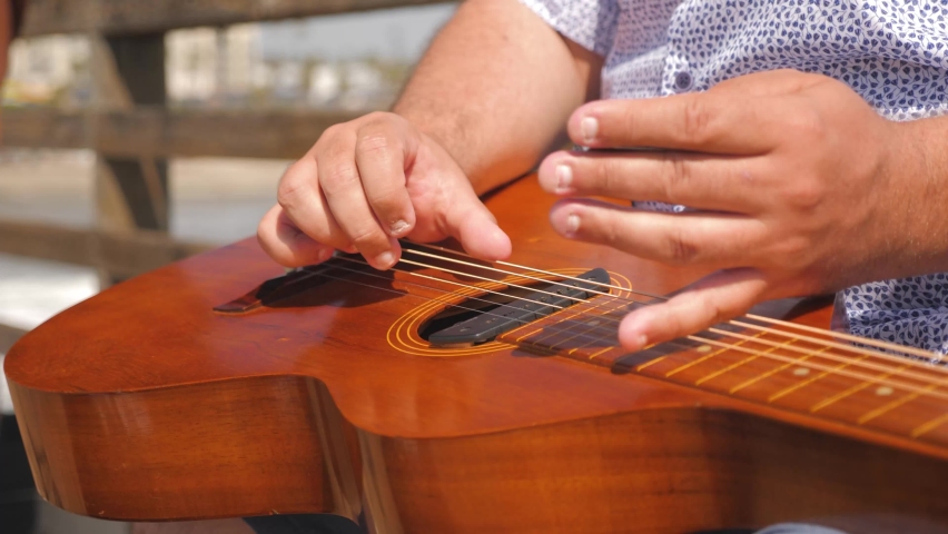 playing guitar flat on lap