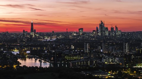 Establishing Aerial View Shot of London UK, beyond wow late sunset, United Kingdom, London Skyline, City of London, crimson and red sky