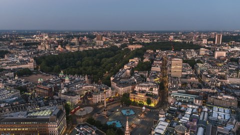 Establishing Aerial View Shot of London UK, United Kingdom, Trafalgar Square, Buckingham Palace, St James Park, very early morning