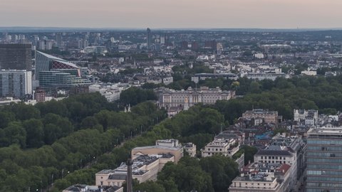 Establishing Aerial View Shot of London UK, Buckingham Palace and St James's Park, United Kingdom, typical day