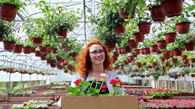 Female florists walking in greenhouse working with flowers and preparing orders. - Powered by Shutterstock - Get 15% off with code: PIKWIZARD15