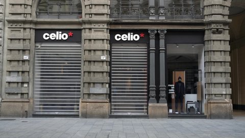 Europe, Italy, Milan 11/16/2020 - completely deserted places of tourist interest, without people, for covid-19 Coronavirus pandemic - Via Dante and Cordusio square empty - Celio store closed