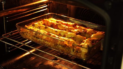 cooking lasagna in a glassy form in the oven. Italian cuisine at home with their own hands. 