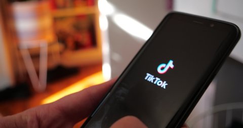 Tiktok app scrolling through social media networking feed