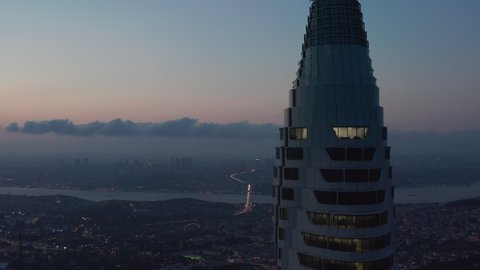 Circling Istanbul Skyscraper Skyline in the distance next to New TV Tower from epic Aerial Perspective at Dusk, Slide right, Istanbul, Turkey on September 17th 2020