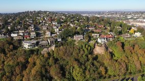Aerial / drone footage of seaside bluffs and cliffs at Briarcliff, Interbay and Magnolia, Lawton Park, upscale, affluent neighborhoods uptown by Puget Sound, in Seattle, Washington
