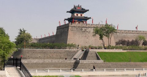 Xi'an, China, October 7, 2020: The beautiful scenery of the 600-year-old Ming Dynasty city wall and Huancheng Park in Xi'an, Shaanxi, China in autumn