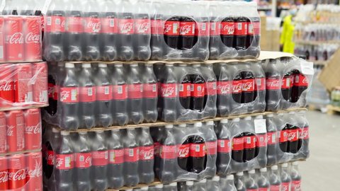 Tyumen, Russia-November 07, 2020: Coca Cola in packages. Coca Cola Company is leading manufacturer of soda drinks in the world.