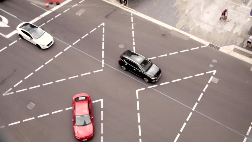 A busy intersection in Adelaide SA Australia. The video contains cars and various different demographics of people. Video Recorded as a timelapse in 1080p and uploaded as a H.264