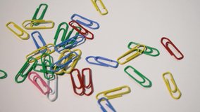 paper clip red yellow green white background pink blue 4k office working device 