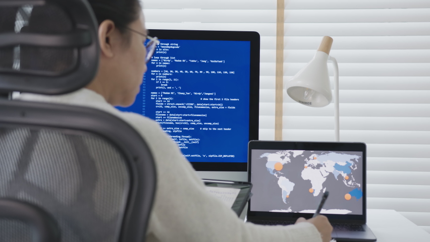Back rear view of young asian woman, freelance data scientist work remotely at home coding programming on Big data mining, AI data engineering, IT Technician Works on Artificial Intelligence Project. Royalty-Free Stock Footage #1062499051