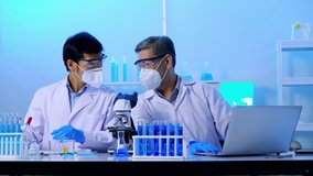 Group of Asian scientists doing some research in the laboratory. - Powered by Shutterstock - Get 15% off with code: PIKWIZARD15