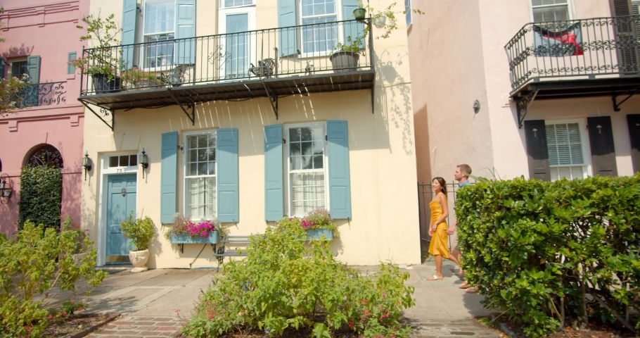 Couple Walking Past Historic Homes in Downtown Charlotte, SC