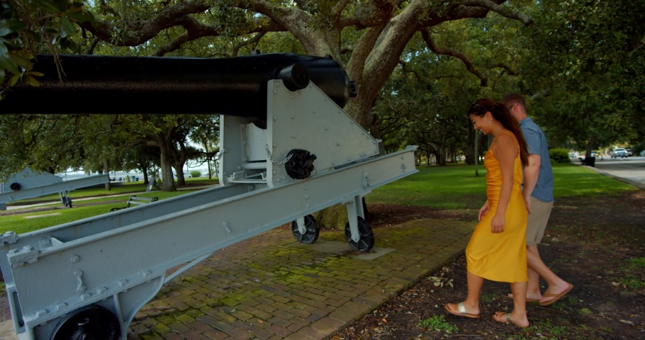 Couple Walking Past Historic Cannons in Park, Charlotte