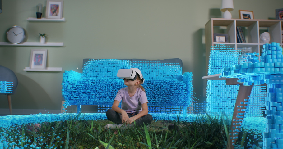 Zoom out view of girl putting on VR helmet in living room near sofa then starting to explore virtual jungles against mountain ridge