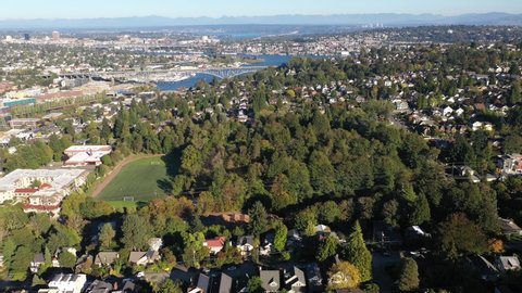 Aerial / drone footage of Northlake, Fremont, Interbay, Lawton Park, Fremont Cut, Salmon Bay, upscale, affluent neighborhoods uptown by Puget Sound, in Seattle, Washington