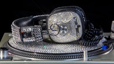 Diamond covered headphones spinning on a crystal vinyl loopable cinemagraph 