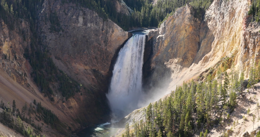 Yellowstone Park Lower Falls Grand Canyon view 4K. Geyser Yellowstone in Wyoming, Montana and Idaho, USA. Geothermal geological environment ecosystem landscape. Biology geography and ecology.