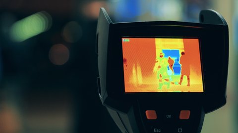Screen of a thermal camera while scanning passers-by