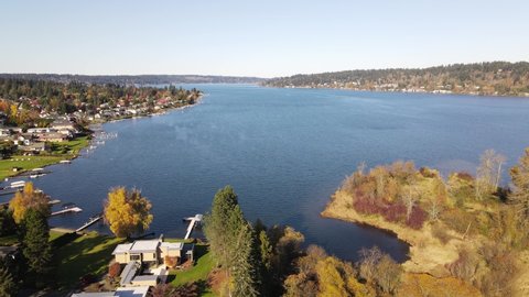 Dolly Forward Drone / Aerial footage of Lake in Sunny Weather near Near Sammamish, Issaquah, Bellevue with Fall / Autumn colors