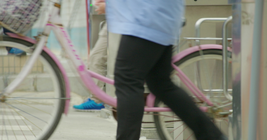 People walking through gates, Shenzen, China
