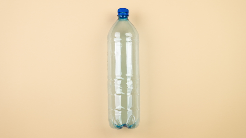 Plastic bottles with stainless steel refillable bottle. The plastic alternative. Stop motion, the plastic bottle in motion is replaced by a stainless steel bottle. Royalty-Free Stock Footage #1062543829