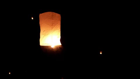 Thousands of glowing sky lanterns are released into the night sky to wish for good luck as part of a lantern festival.