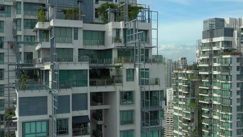 sunny evening singapore city center apartment complex front top aerial panorama 4k