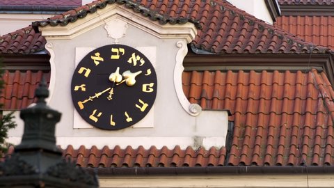 The Jewish Town Hall in Prague Time lapse Arrow moves on clock with Hebrew Numbers on Synagogue 