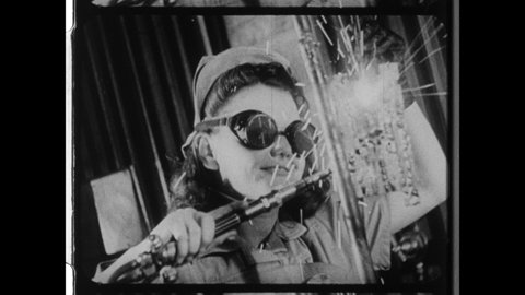 1940s New York City. Female metalworker in industrial workshop welding. 4K Overscan of Vintage 16mm Film Print